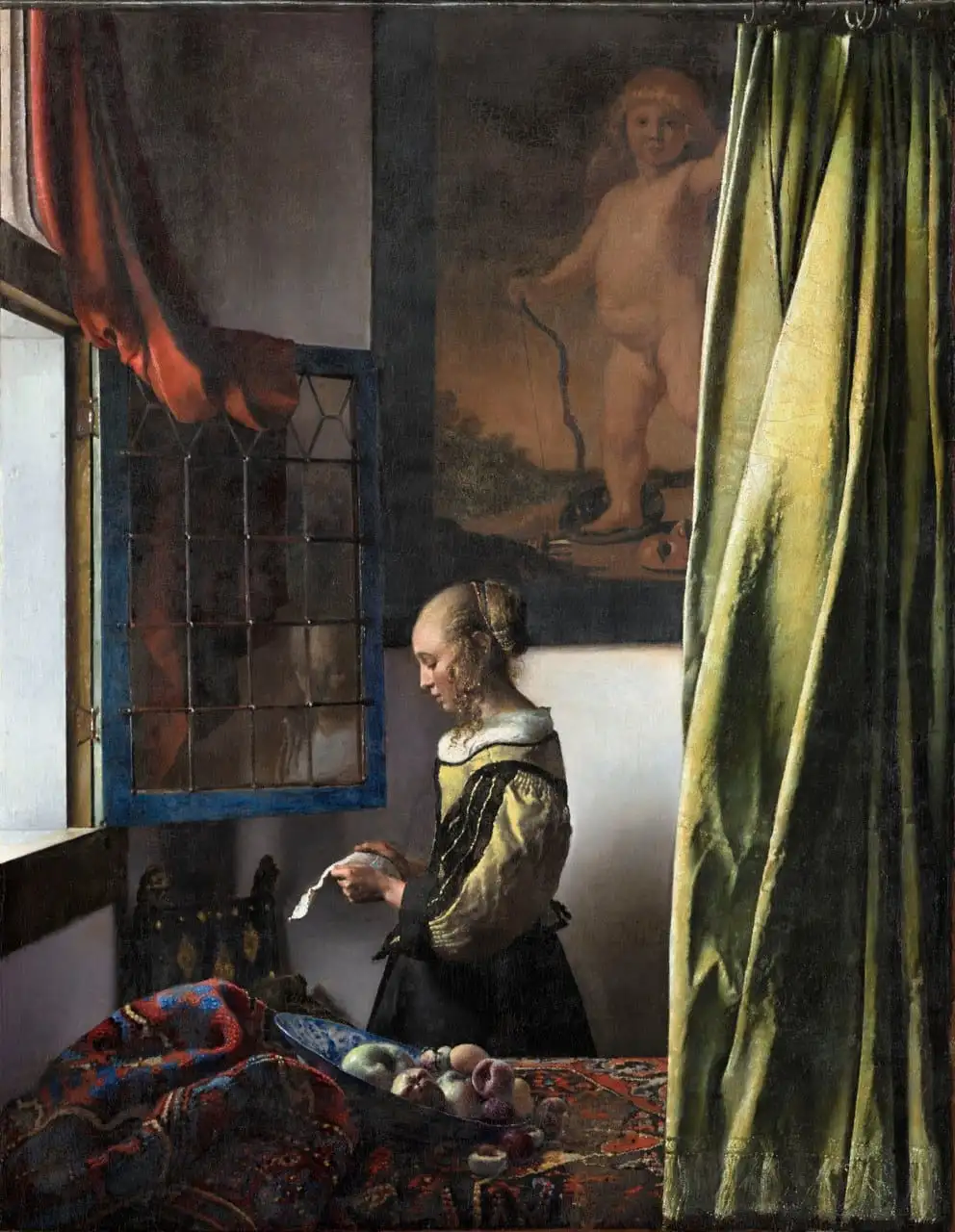 Girl Reading a Letter at an Open Window by Johannes Vermeer