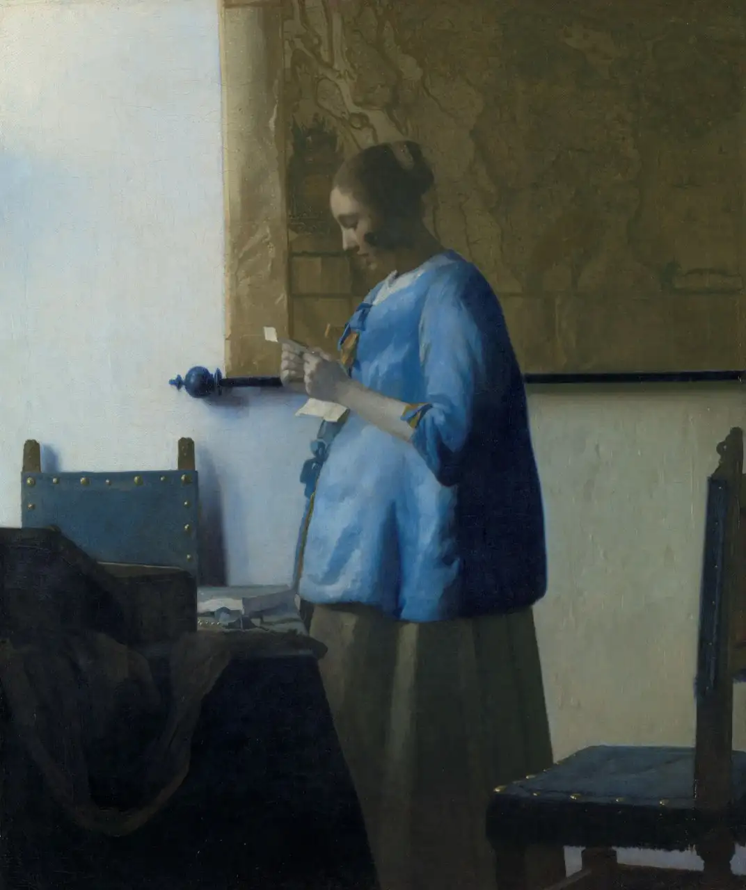 Woman in Blue Reading a Letter by Johannes Vermeer